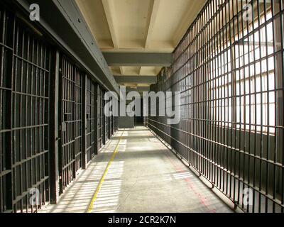 Interior view of closed jail cell block in an unused rundown government owned facility. Stock Photo