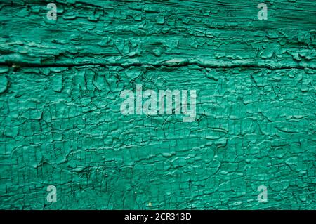 Many layers of peeling paint. Grainy painted green surface, beautiful green background, Stock Photo