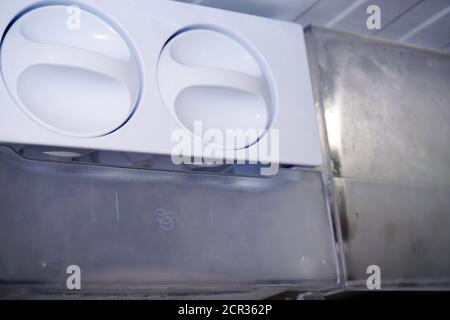 Ice dispenser in the fridge Stock Photo