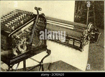 . The Street railway journal . after which it is wound with one wrap to hold it.The accompanying illustrations show the attachment ap-plied to a Burroughs machine and carriage with wide print-ing roller to take a strip of paper 18 in. wide. When thepaper is disconnected from the upper roller, the adding ma-chine can be used as ordinarily. The device is employed at present for making out payrolls of trainmen and night force of car cleaners, inspectorsand electrical repairmen. These last three classes of employ-ees have their entries made at the rate per night instead ofby hours and minutes, as Stock Photo