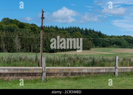 Germany, Mecklenburg-Western Pomerania, Ruegen Island, Lancken-Granitz, an old street lamp stands on a railroad track in the Southeast Ruegen biospher Stock Photo
