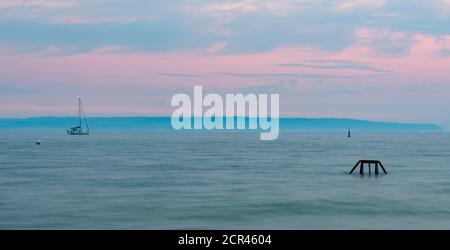 Germany, Mecklenburg-Western Pomerania, Ruegen island, Ostseebad Binz, pastel-colored coast shortly before sunrise, Baltic Sea Stock Photo