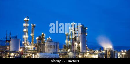 Petroleum refinery after sunset with lights Stock Photo