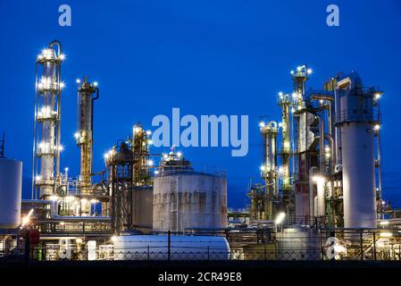 Petroleum refinery after sunset with lights Stock Photo