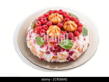Homemade jelly cake with milk, cookies and raspberry isolated on white background. side view. close up. Stock Photo