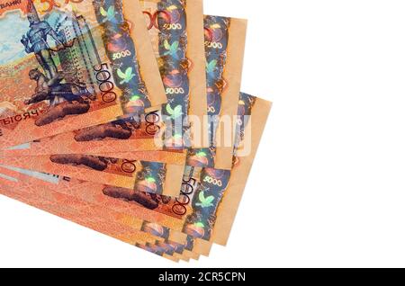 5000 Kazakhstani tenge bills lies in small bunch or pack isolated on white. Mockup with copy space. Business and currency exchange concept Stock Photo
