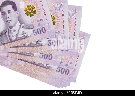 500 Thai baht bills lies in small bunch or pack isolated on white. Mockup with copy space. Business and currency exchange concept Stock Photo