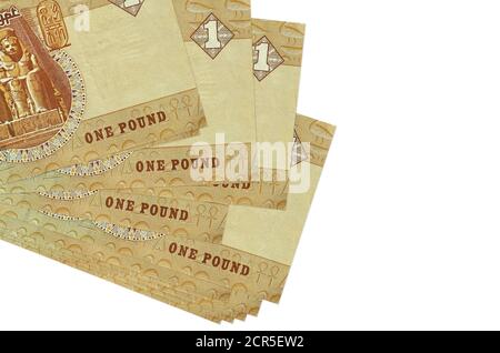 1 Egyptian pound bills lies in small bunch or pack isolated on white. Mockup with copy space. Business and currency exchange concept Stock Photo