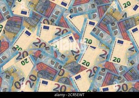 20 euro bills lies in big pile. Rich life conceptual background. Big amount of money Stock Photo