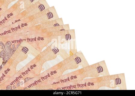 10 Indian rupees bills lies isolated on white background with copy space stacked in fan close up. Payday time concept or financial operations Stock Photo