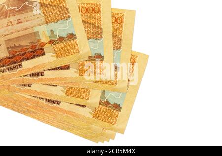 1000 Kazakhstani tenge bills lies in small bunch or pack isolated on white. Mockup with copy space. Business and currency exchange concept Stock Photo