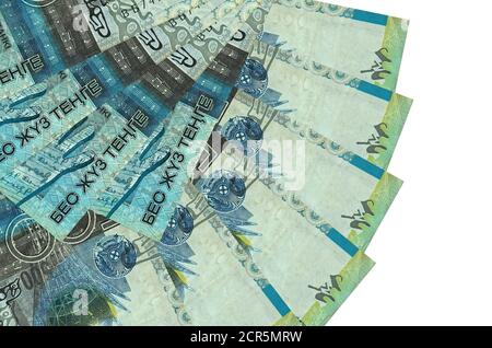 500 Kazakhstani tenge bills lies isolated on white background with copy space stacked in fan shape close up. Financial transactions concept Stock Photo