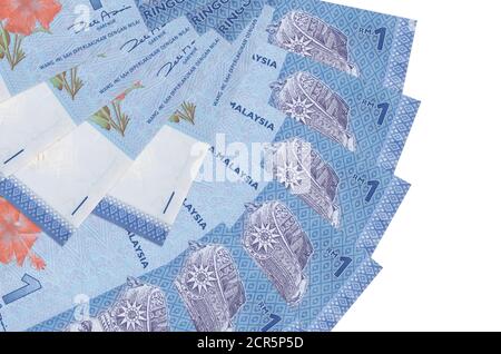 1 Malaysian ringgit bills lies isolated on white background with copy space stacked in fan shape close up. Financial transactions concept Stock Photo