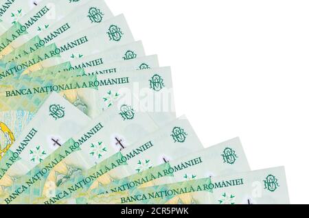 1 Romanian leu bills lies isolated on white background with copy space stacked in fan close up. Payday time concept or financial operations Stock Photo