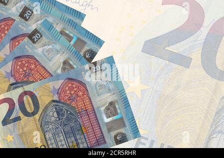 20 euro bills lies in stack on background of big semi-transparent banknote. Abstract business background with copy space Stock Photo