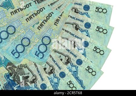 500 Kazakhstani tenge bills lies isolated on white background with copy space stacked in fan shape close up. Financial transactions concept Stock Photo