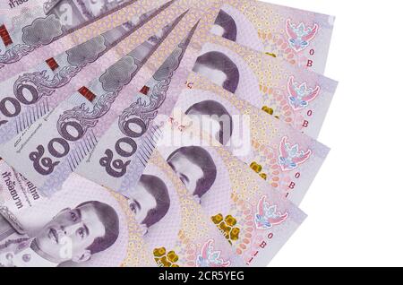 500 Thai baht bills lies isolated on white background with copy space stacked in fan shape close up. Financial transactions concept Stock Photo