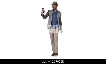 Attractive man in casual clothes hat hipster stylerecording vlog or making a video call on white background. Stock Photo