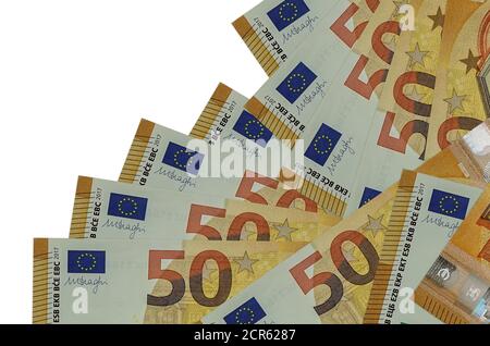 50 euro bills lies in different order isolated on white. Local banking or money making concept. Business background banner Stock Photo