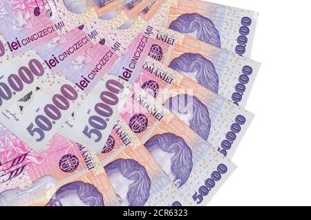 50000 Romanian leu bills lies isolated on white background with copy space stacked in fan shape close up. Financial transactions concept Stock Photo