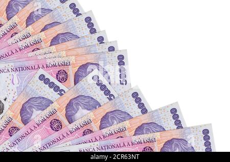 50000 Romanian leu bills lies isolated on white background with copy space stacked in fan close up. Payday time concept or financial operations Stock Photo