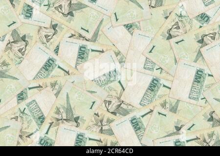 1 Brazilian real bills lies in big pile. Rich life conceptual background. Big amount of money Stock Photo