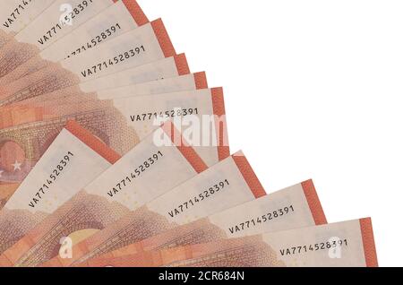 10 euro bills lies isolated on white background with copy space stacked in fan close up. Payday time concept or financial operations Stock Photo