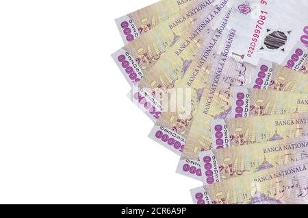 50000 Romanian leu bills lies isolated on white background with copy space. Rich life conceptual background. Big amount of national currency wealth Stock Photo