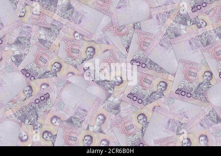 500 Thai baht bills lies in big pile. Rich life conceptual background. Big amount of money Stock Photo