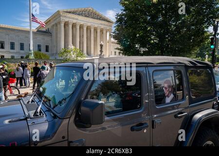 Washington, United States. 19th Sep, 2020. A car with a cut out of Supreme Court Justice Ruth Bader Ginsburg drives by at the United States Supreme Court as thousands gather to mourn her loss in Washington, DC on Saturday, September 19, 2020. Ginsburg died at 87 after a battle with pancreatic cancer yesterday. Photo by Ken Cedeno/UPI Credit: UPI/Alamy Live News Stock Photo