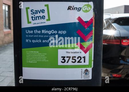 Windsor, UK. 19th September, 2020. A sticker for the RingGo application applied to the side of a parking meter. The Royal Borough of Windsor and Maidenhead switched its cashless phone parking solution from Parkmobile to RingGo with effect from 20th August 2020. Credit: Mark Kerrison/Alamy Live News Stock Photo