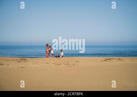 Family on the beach at Narbonne Plage in summer Stock Photo