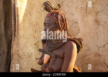 Himba woman with traditional headdress Stock Photo