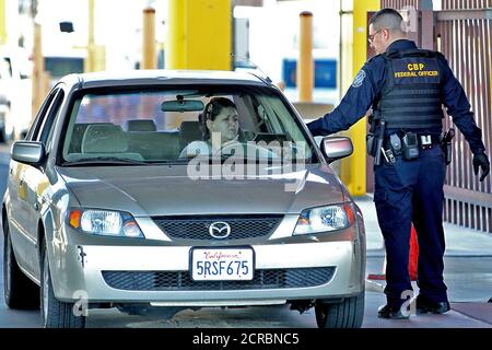 CBP field officer checks ID at the DeConcini Nogales Port of Entry. Stock Photo