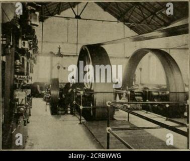 . The street railway review . At the present time but one engine, one generator, and one boilerarc in operation; these are furnishing sufficient power for the com-panys present needs, allowing Ihc other engine and generator to beheld in reserve. Tlie wells are ordinary driven wells and go down to what is knownas the gas sand beds about 1000 or 1200 ft. below the surface. Thegas rises at a natural pressure of something over 300 lb. per sq. in.It is piped to the station and there passed through a gas regulator.. Stock Photo