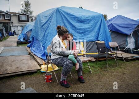 Kadee Ingram, 28, holds her son Sean, 2, at SHARE/WHEEL Tent City 3 outside Seattle, Washington October 13, 2015.    REUTERS/Shannon Stapleton/File Photo        GLOBAL BUSINESS WEEK AHEAD PACKAGE - SEARCH 'BUSINESS WEEK AHEAD MAY 30'  FOR ALL IMAGES