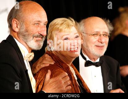 Honorees Paul Stookey, Mary Travers and Peter Yarrow of Peter, Paul and Mary arrive at the 2006 Songwriters Hall of Fame induction ceremony at the Marriott Marquis Hotel in New York June 15, 2006. REUTERS/Eric Thayer (UNITED STATES)