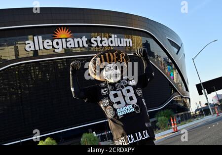 A man poses inside the Raider Image team store at Allegiant Stadium, Sunday  March 7, 2021, in Las Vegas. The stadium is the home of the Las Vegas  Raiders and the UNLV