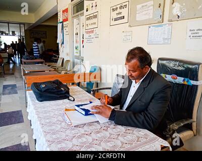 DISTRICT KATNI, INDIA - JANUARY 27, 2020: Asian lawyer working in office room at Supreme court premises. Stock Photo