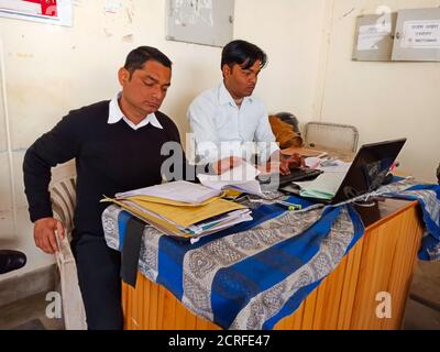 DISTRICT KATNI, INDIA - JANUARY 27, 2020: Asian advocates association member working with colleague at high court premises. Stock Photo