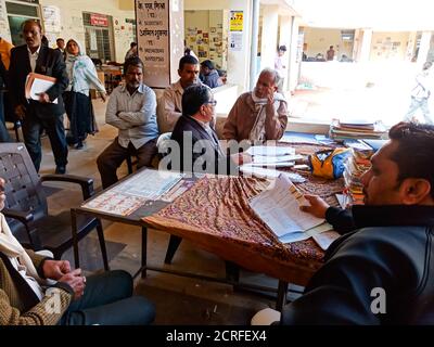 DISTRICT KATNI, INDIA - JANUARY 27, 2020: Indian lawyer working in office table at Supreme court premises. Stock Photo