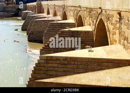 View of the first century Roman bridge (post 2007 restoration) across river Guadalquivir, Cordoba, Spain. Stock Photo