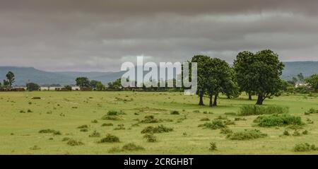 A beautiful landscape with view of black cloud and indian village. Stock Photo