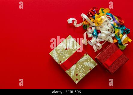 Christmas background with gift boxes and decorations on red.  Stock Photo