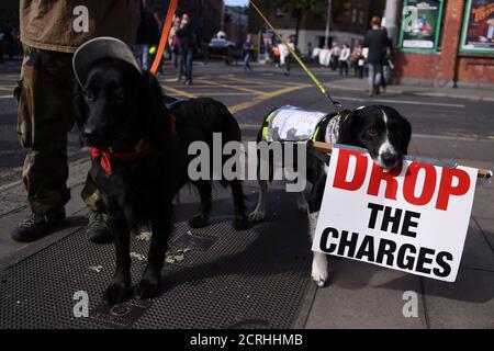 Dogs join a march protesting against household water charges, as demonstrators urge the Irish Government to accept the European Commission's Apple tax ruling of 13 billion euros ($14.6 billion) in back taxes, in Dublin, Ireland September 17, 2016.  REUTERS/Clodagh Kilcoyne