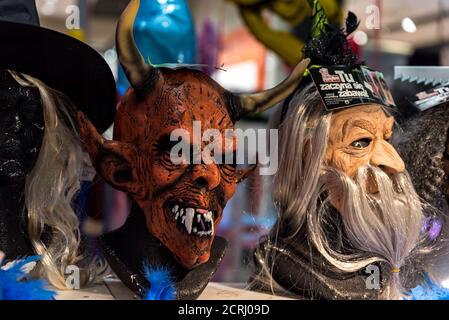 Warsaw, Poland - January 17, 2020: Scary masks on display. Halloween costumes, carnival costumes. Terrible costumes to scare. Halloween gadgets. Stock Photo