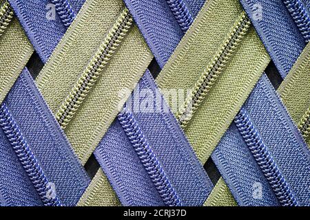 Zip background texture of zippers sliders. a lot of zippers in different colors. sewing clothes, atelier, fabric and accessories shop. hobby diy conce Stock Photo