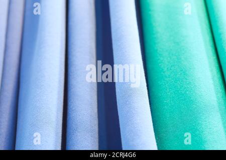 Abstract background of blue turquoise green. Abstract texture of fabric or textile material of blue color. Stock Photo
