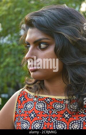 a indian girl poses for portfolio shoot at outside of studio 2crjmkg