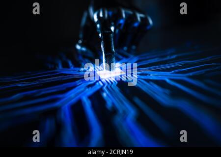 Digitalization Concept: Futuristic Robot Arm Interacting with Screen, Finger Touches Display and Activates Artificial Intelligence. Visualization of Stock Photo